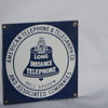 A. T & T Porcelin Sign, 