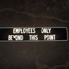 metal employee only beyond this point sign