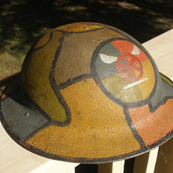 Camouflaged American WWI helmet with unknown transport corps insignia.  - Military and Wartime