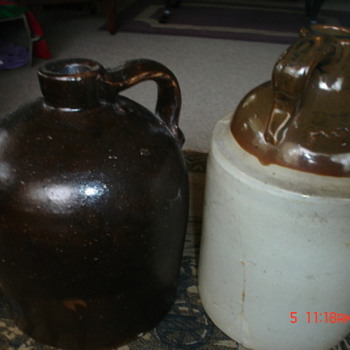 two olg gallon jugs 