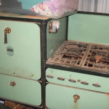 Stove and oven the old turquoise color I think do not really know what color it is.  Even has the oven grades 