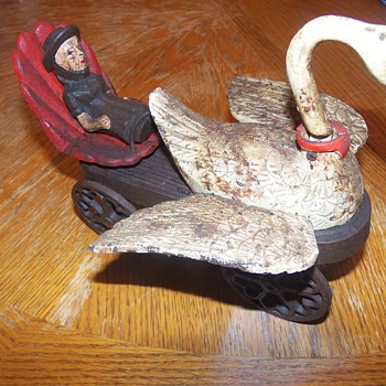 Antique Cast Iron Mother Goose Mechanical Buggy?