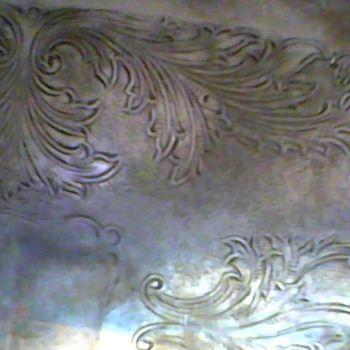 silver container not sure what it was used for can anyone tell me? it has marks on bottom like a lion and a shield