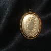 Locket   Does anyone know the date on this?  Is it Brass, gold?  Worth?
