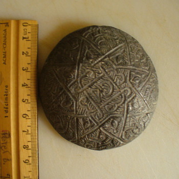 Lead Disk Found in Waterfall with Design