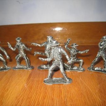 Vintage metal toy cowboys and indians figurine set