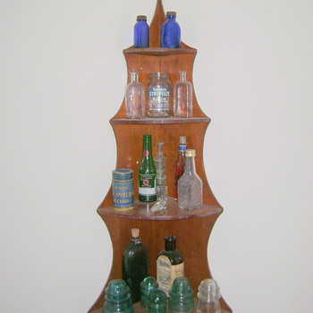 My small glass collection and Edison record on corner shelf. - Bottles