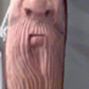Face  carved walking stick 