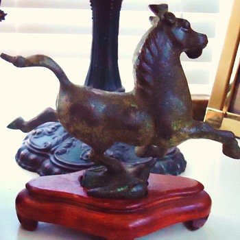 Bronze cast running horse, no marks, do not know age or origin