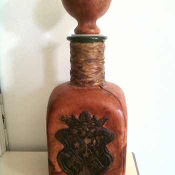 Red Italian leather covered liquor bottle.  - Bottles