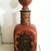Red Italian leather covered liquor bottle. 