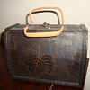I bought this at a church sale for 15 $, I thought it was so rad, looked very old and Im thinking its maybe a handbag?