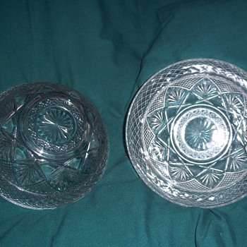 2 identical bowls but different numbers on the bottom. Crystal or glass??