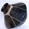 Old large pottery w/ rawhide wrap