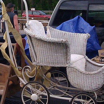 Antique wicker baby stroller. 