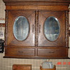 Antique Oak Two Door Cabinet...Beveled Oval Mirrors...Two Drawers With Key