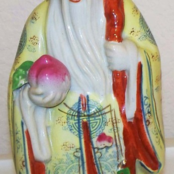 Asian - Chinese- Figurine Holding Fruit