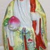 Asian - Chinese- Figurine Holding Fruit