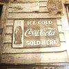 Photograph with early Coca- Cola advertising