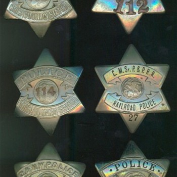 A group of railroad police "pie plate" badges used in Chicago during the 1920's