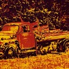 Posterized photos of abandoned flatbed pickup 