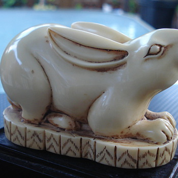 White Rabbit on Stand Took Second Pic. of Bottom. - Animals