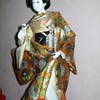 Geisha removing her outer Kimono