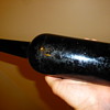 Very early dark amethyst wine bottle