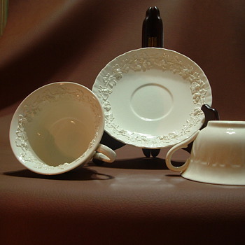 wedgewood embossed queensware  with pattern inside cups