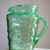 Triangular Green glass pitcher that seems older than most