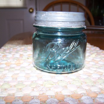 1 pint wide mouth green ball jar with number 5 on bottom.  Ball on front and word Special below Ball