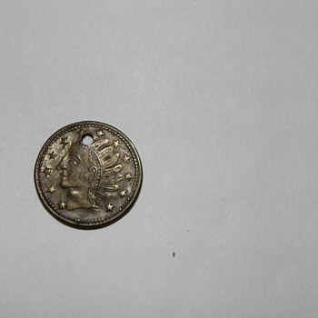 Unknown Small Indian head coin with hole dated July 1868 with leaves