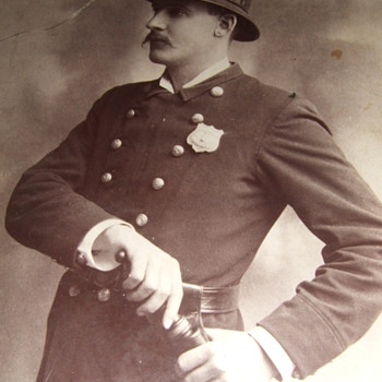 Cabinet card occupational of policeman with billy club and badge