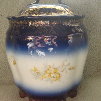 Vintage biscut Jar. Blue gold and yellow flowers. 