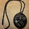 Beautiful Vulcanite locket on jet beaded necklace.