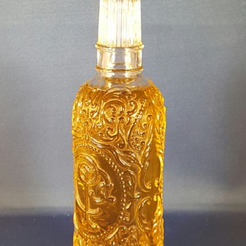 Embossed C.P.C perfume bottle. On bottom AVON 1979 - Bottles