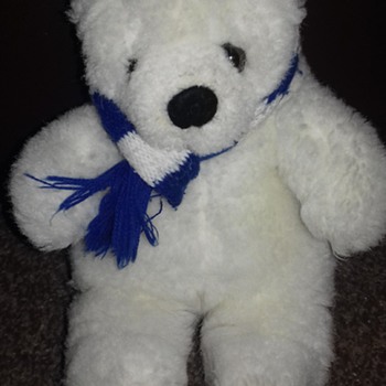 White teddy bear blue and white scarf sitting position - Animals