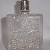 Perfume bottle with unique stopper.