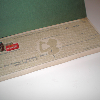 A book of unused 1940s Coca-Cola checks