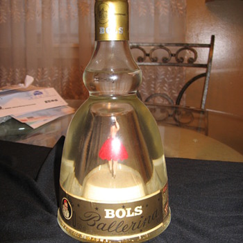 music box inside a liquor bottle - Bottles