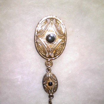 unknown gold and black onyx pin