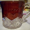 Colored, cut glass mug