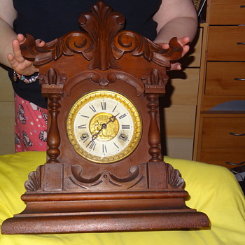 old wooden clock angel blowing bubbles on face - Clocks