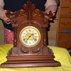 old wooden clock angel blowing bubbles on face