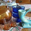 Eng. candle holder, cobalt blue dishes, and orange pitcher and glasses?