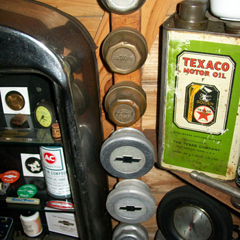 Chevrolet and Oakland Hubcaps and Texaco can