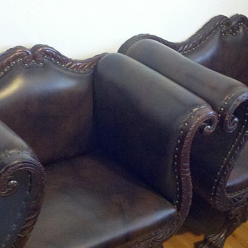 Antique camel back loveseat and chair.