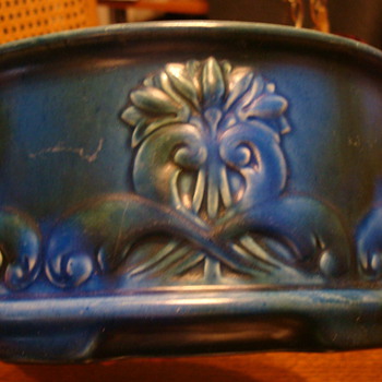 Blue bowl with a rising sun sign on the bottom - Art Pottery