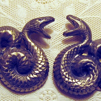 Pair pressed metal coiled serpent dress clips
