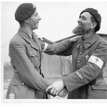 WWII Belgian Chaplain & French Chaplain congratulating each other on being liberated from Nazi POW Camp by U.S. Army, 1945 - Military and Wartime